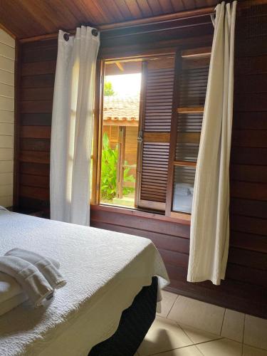 Katil atau katil-katil dalam bilik di Vale do Sonho Hotel