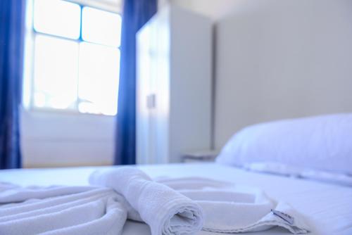 Ένα ή περισσότερα κρεβάτια σε δωμάτιο στο Alfama Guest House