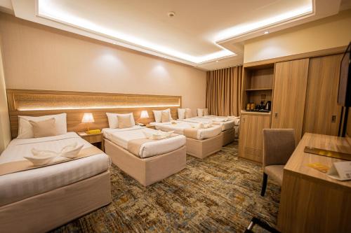 Katil atau katil-katil dalam bilik di Snood Al Azama Hotel