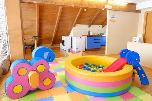 a childs play room with a toy tub and balls at Hotel Mondolé - Azzurro Club in Prato Nevoso