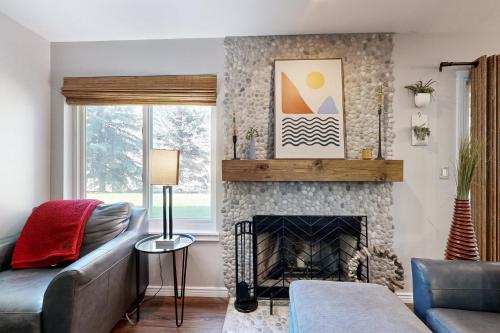 a living room with a couch and a fireplace at Eagle River's Charmer in Edwards