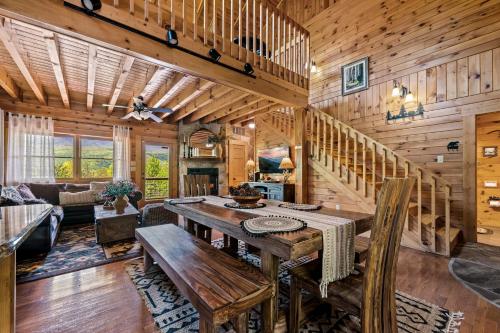 a dining room and living room with a wooden wall at Grand View in Rocky Grove