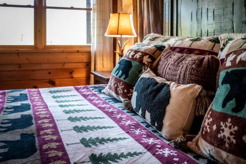 a bedroom with a bed with a quilt on it at Grand View in Rocky Grove