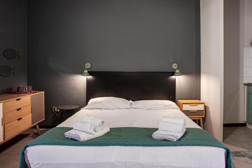 Ένα ή περισσότερα κρεβάτια σε δωμάτιο στο Oleandri Suite Hotel