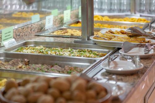 a buffet line with many different types of food at Apartamentos Pez Azul in Puerto de la Cruz