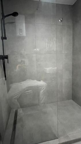 a shower with a glass door in a bathroom at OASE im grünen Hinterhof, EG, Ruhe, Terrasse, Carport, free PayTV, Kaffee&Tee, Fahrräder in Duisburg