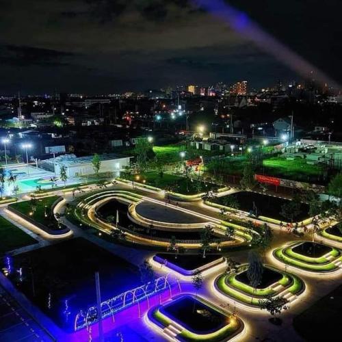a night view of a park with lights in a city at La Casa De Lita in Manila