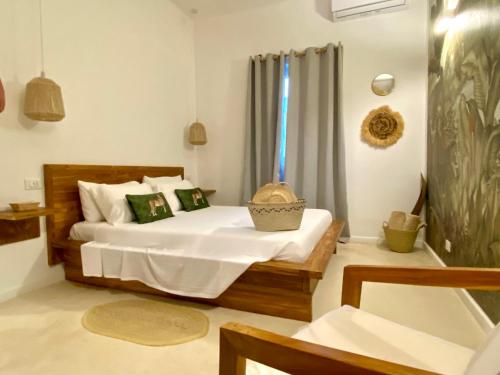 a bedroom with a bed and a window at Luxury Lions Villas Zanzibar - with Private Cook&Infinity Pools in Kiwengwa
