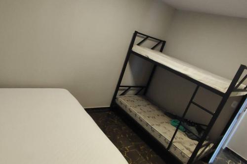 a room with a bunk bed in a room at Rancho do Vale in Carlópolis