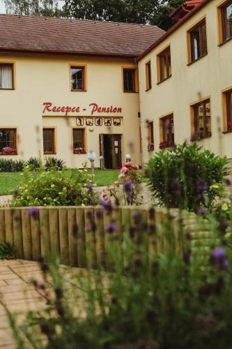 a building with a fence in front of it at Sport - Relax Buky in Františkovy Lázně