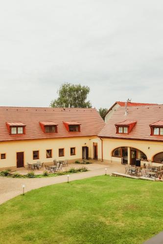 a large building with a lawn in front of it at Sport - Relax Buky in Františkovy Lázně