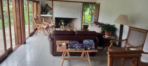 a living room with a couch and a table at Casa de campo, La Resolana in Rivera
