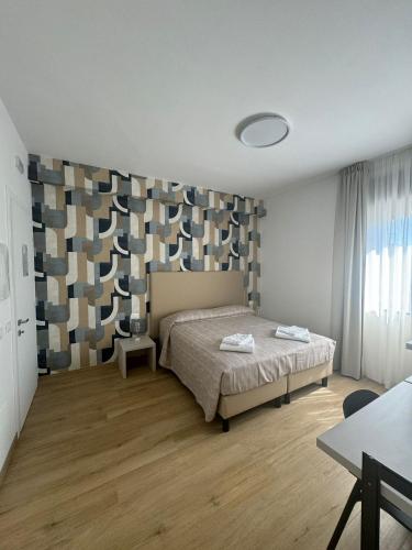 Postel nebo postele na pokoji v ubytování Guest House al porto