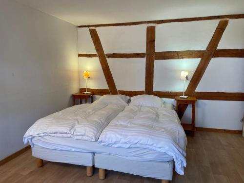 Postel nebo postele na pokoji v ubytování Gîte Nicole proche du Europa Park