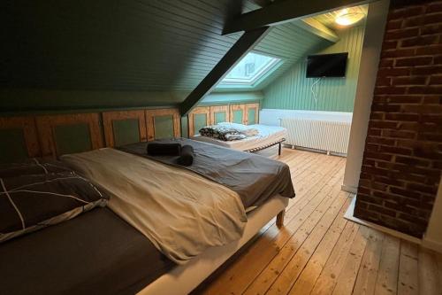 a bedroom with a large bed in a room at Grande Maison 17 personnes in Arras