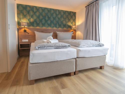 Postel nebo postele na pokoji v ubytování Deichblume