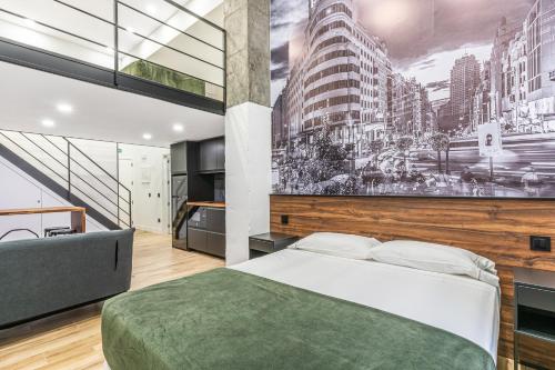 a bedroom with a bed and a large wall mural at VR OBREGON APARTMENTS in Madrid