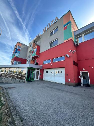 a large building with a red and multicolored at Hotel Muza in Košice