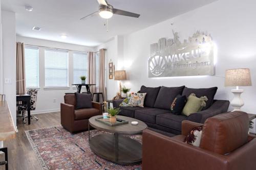a living room with a couch and a table at Brand new Apt Oak Mt St Park Lots of Amenities in Pelham