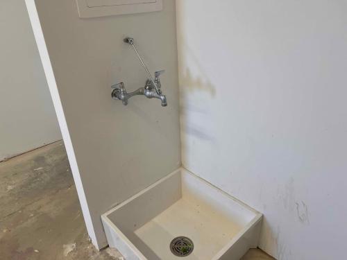 a bathroom with a sink with a faucet at Brand new Apt Oak Mt St Park Lots of Amenities in Pelham