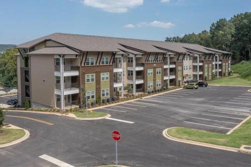 a parking lot of a apartment complex with a stop sign at Brand new Apt Oak Mt St Park Lots of Amenities in Pelham