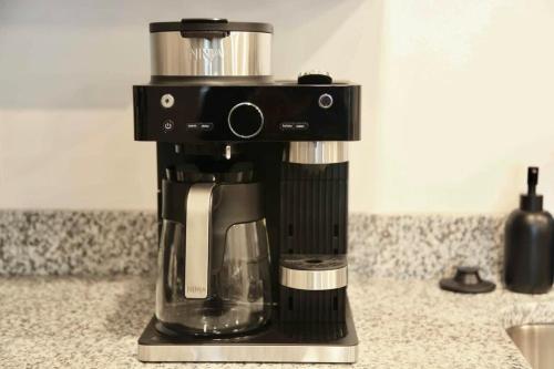 a black coffee maker sitting on top of a counter at Near Oak Mt Amphitheatre and Pelham Civic Complex in Pelham