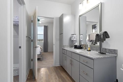 a bathroom with a sink and a mirror at Near Oak Mt Amphitheatre and Pelham Civic Complex in Pelham