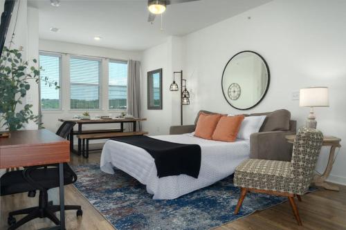 a bedroom with a bed and a desk and a chair at NEW Apt Oak Mt St Park Great Amenities in Pelham
