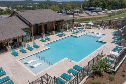 an aerial view of a swimming pool with chairs and a house at NEW Apt Oak Mt St Park Great Amenities in Pelham