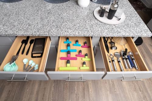 a kitchen counter with a drawer filled with cooking utensils at Luxury 2BR 2 bath Townhouse w Garage Near Oak Mt in Pelham