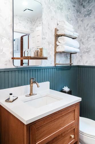 a bathroom with a sink and a mirror at The Sagaponack in Sagaponack
