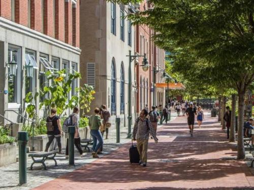 a group of people walking down a city street at Downtown by RISD Gigabite Internet OnSite Free Parking in Providence