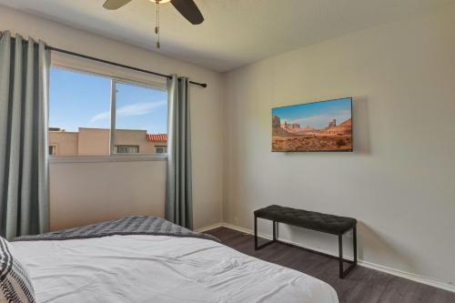 a bedroom with a bed and a window at The Andalusian Fusion by PaseoHomesAZ with Private Spa in Scottsdale