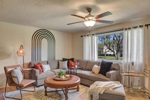 a living room with a couch and a ceiling fan at The Andalusian Fusion by PaseoHomesAZ with Private Spa in Scottsdale
