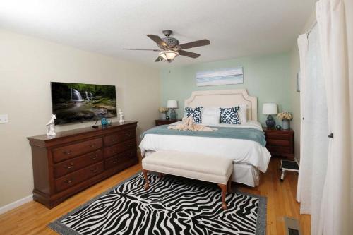 Ένα ή περισσότερα κρεβάτια σε δωμάτιο στο Birdsong Bungalow