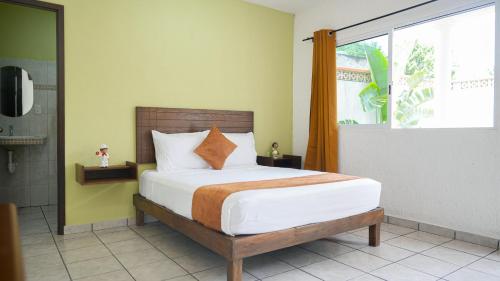 Postel nebo postele na pokoji v ubytování Hotel del Parque