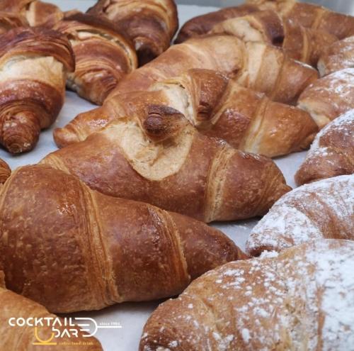 a bunch of croissants and other pastries on a table at Il Buon Risveglio B&B in Agropoli