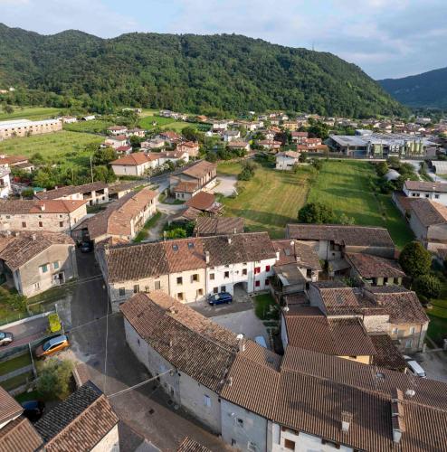 an aerial view of a village with houses and mountains at B&B Annalisa in Segusino