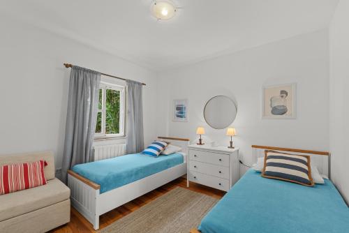 Postel nebo postele na pokoji v ubytování Villa Mia Lea