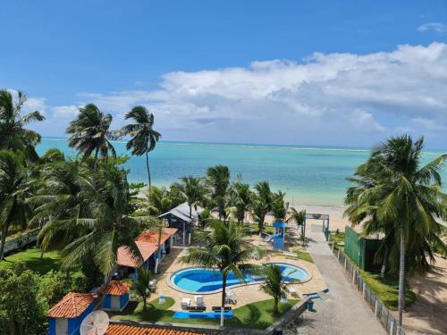 a view of the beach from the balcony of a resort at Paraiso do Sul Maragogi in Maragogi