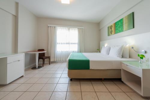a hotel room with a bed and a sink at Bourbon Hotel Fortaleza in Fortaleza