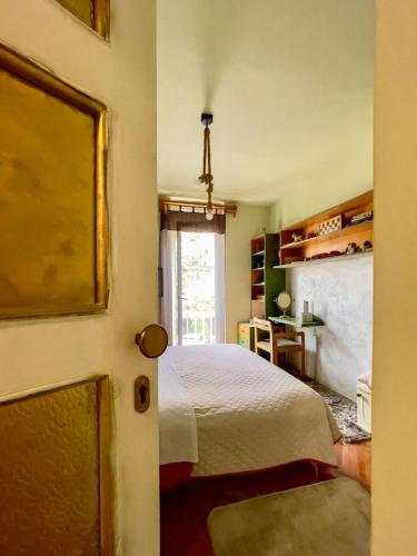 a bedroom with a bed and a window at Apartment Navigator's lodging in Kotor