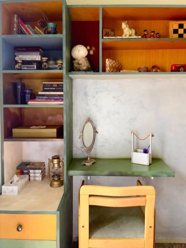 a desk with a mirror and a chair in a room at Apartment Navigator's lodging in Kotor