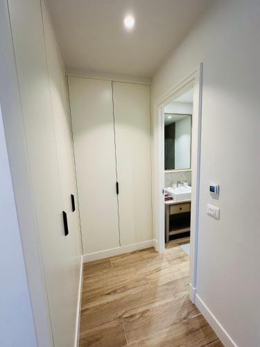 Un ou plusieurs lits dans un hébergement de l'établissement Apartments SLAVA