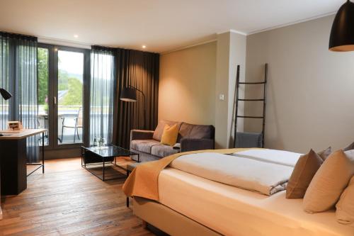 Postel nebo postele na pokoji v ubytování Landidyll Hotel zum Freden