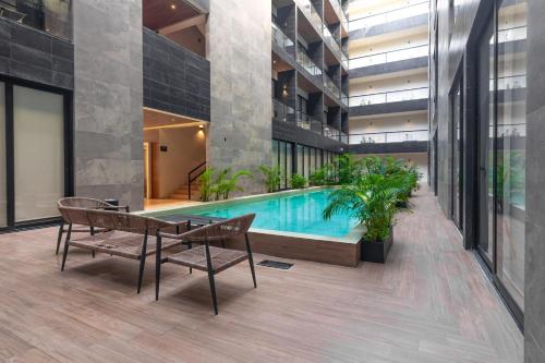 Hồ bơi trong/gần Musa del Carmen By Boutique Apartments MX