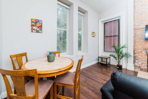 a dining room with a table and chairs at Business Suite - Walkable Entertainment in Pittsburgh