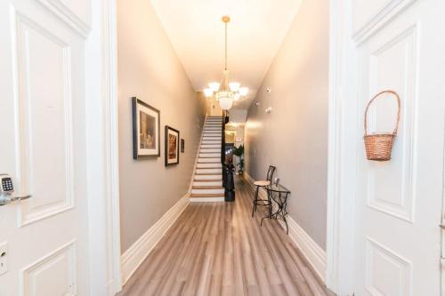 a hallway with a stairway with a stair case at Modern Chic Suite - Amazing Location - GroupStay in Pittsburgh