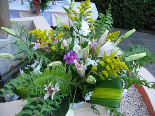 a bouquet of flowers sitting on top of a table at Villa del Sueño in Playa Hermosa
