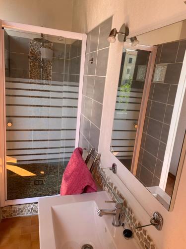 a bathroom with a sink and a mirror at T2 cœur de ville La Londe-Les-Maures in La Londe-les-Maures